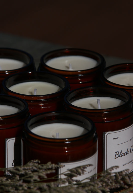 a close up of a bunch of candles on a table